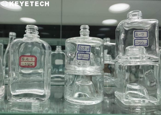 Machines voor het inspecteren van vloeibare poederproducten in glascontainers